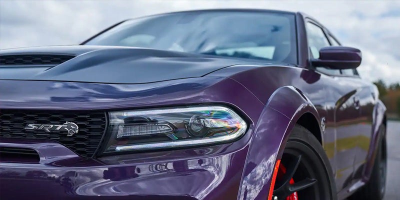 A close look at a purple charger.