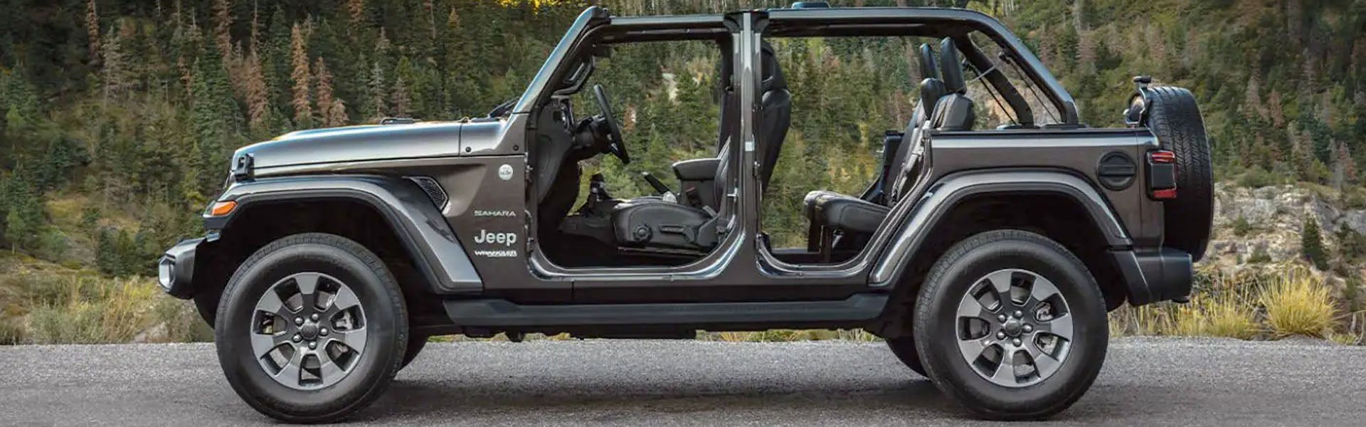 side profile of a jeep wrangler with the doors off