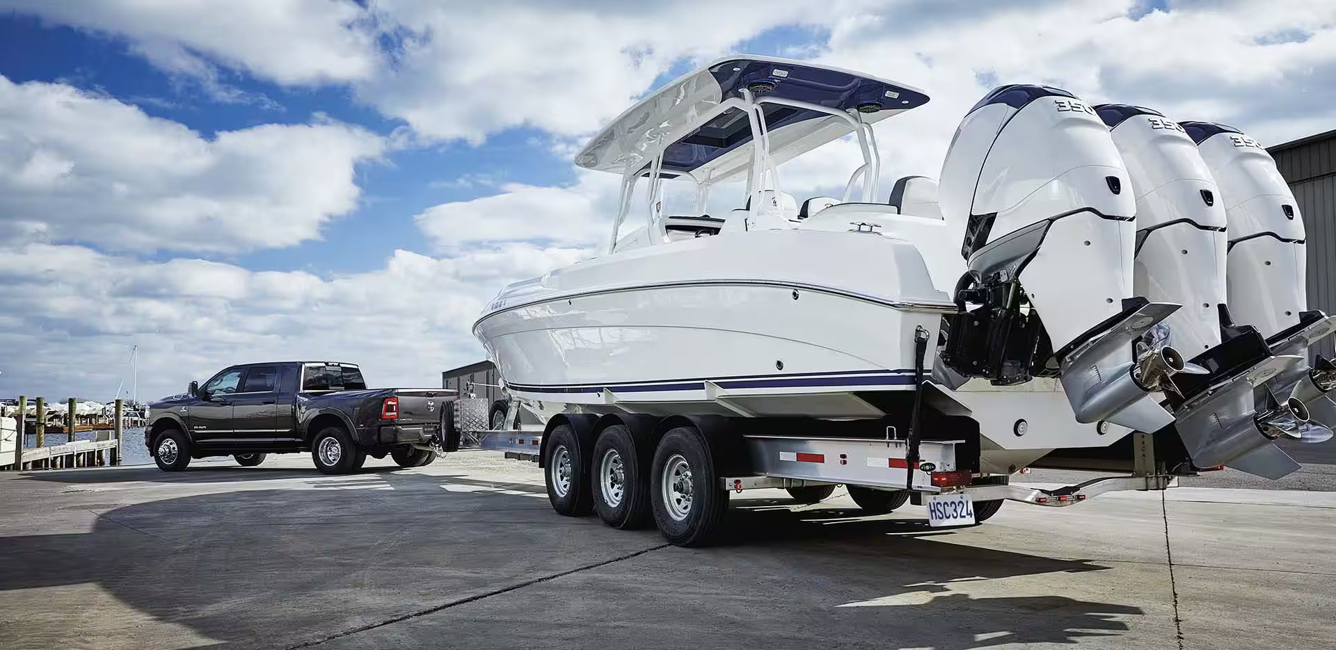 A ram truck pulling a boat.