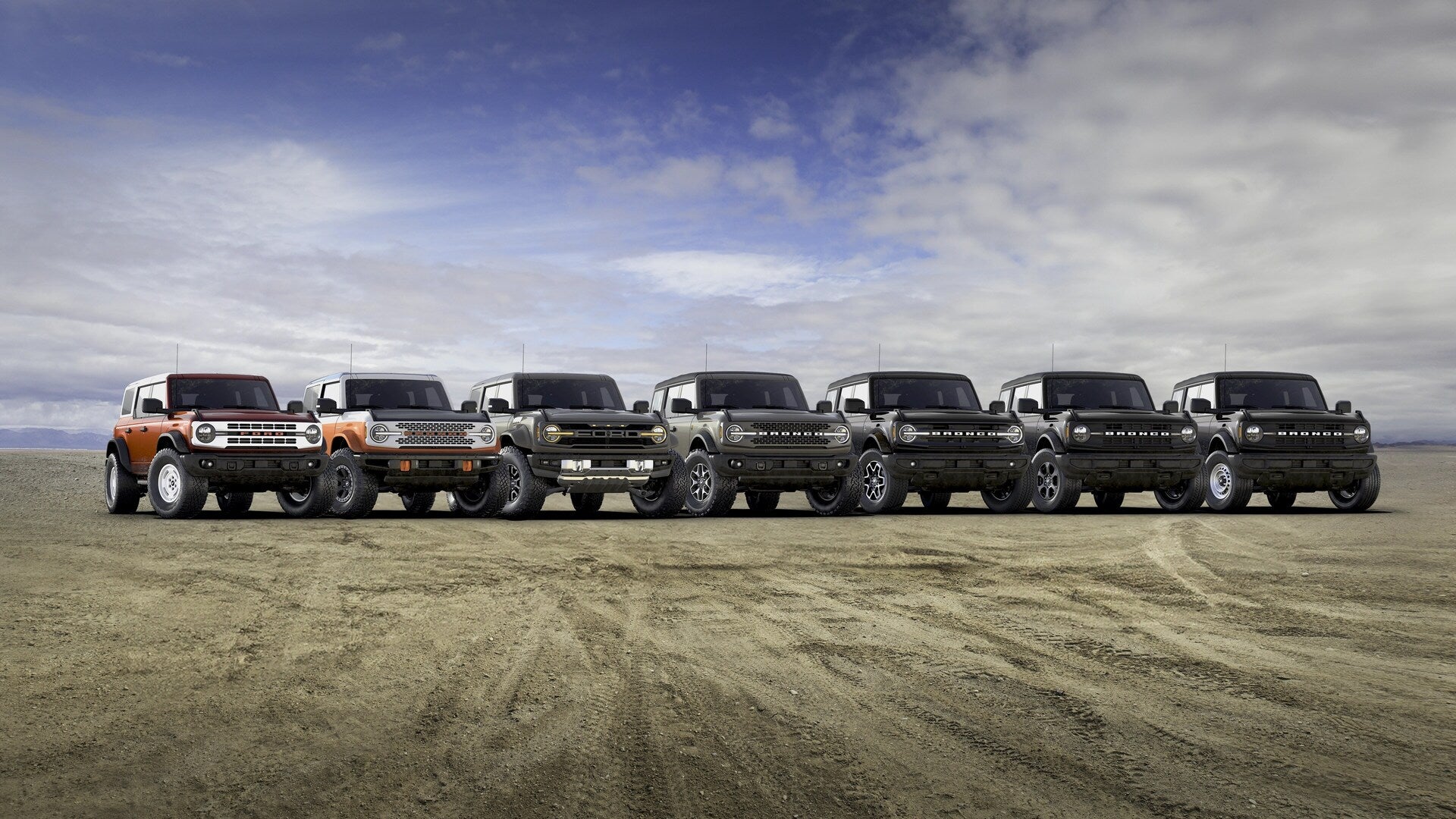 A group of ford broncos sitting parked.