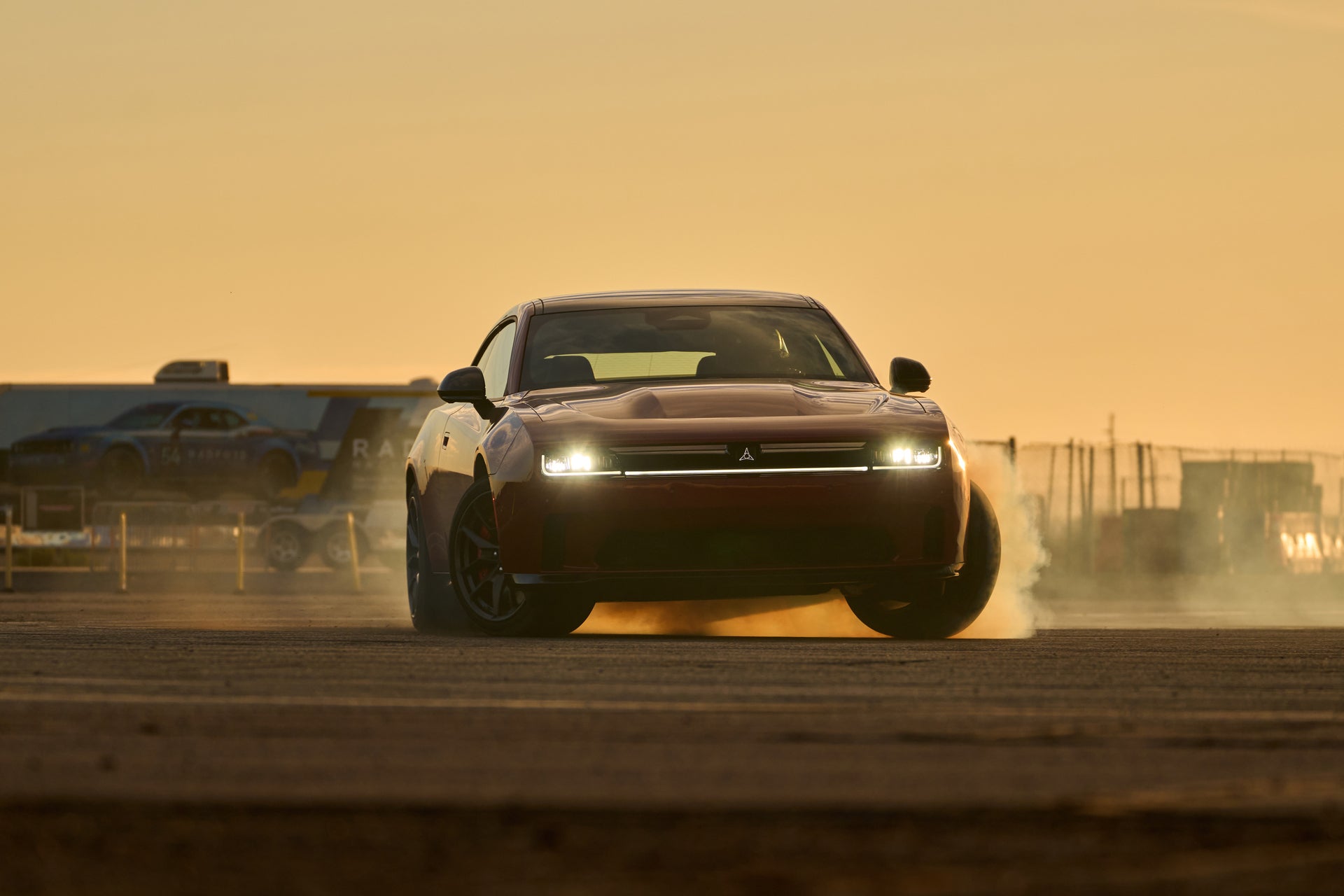 A red car driving on the road.