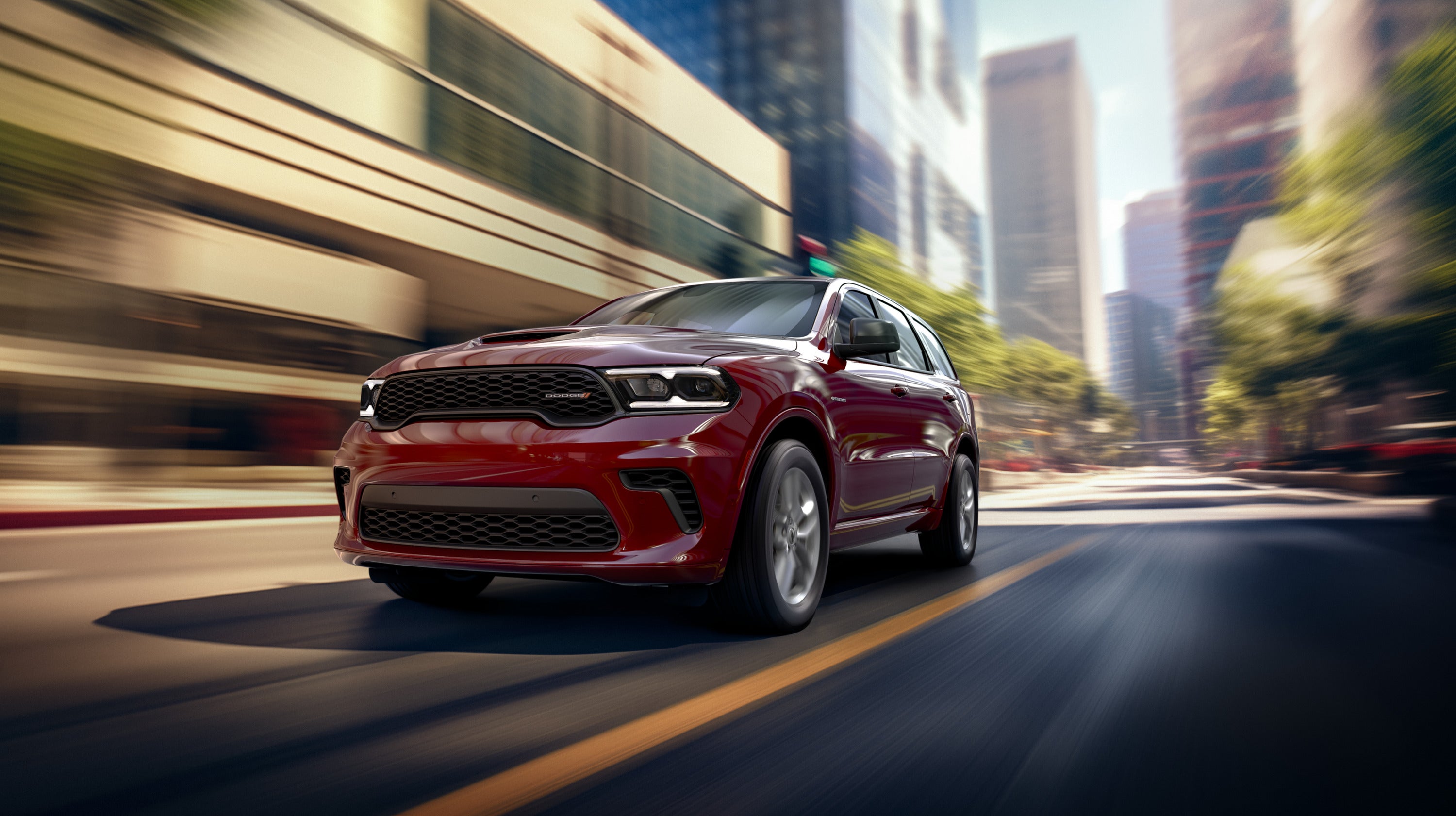 A red durango driving on the road.