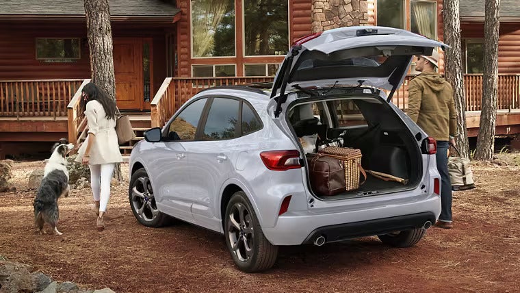 A white car with the trunk open.