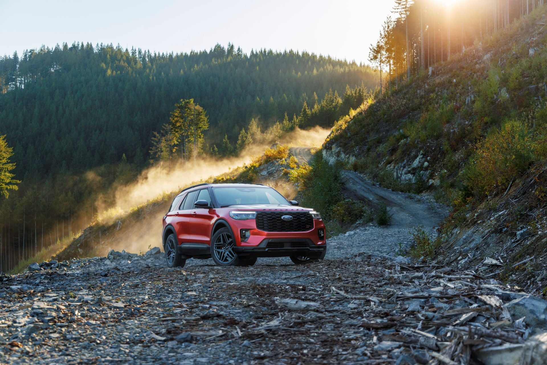 A red suv sitting parked.