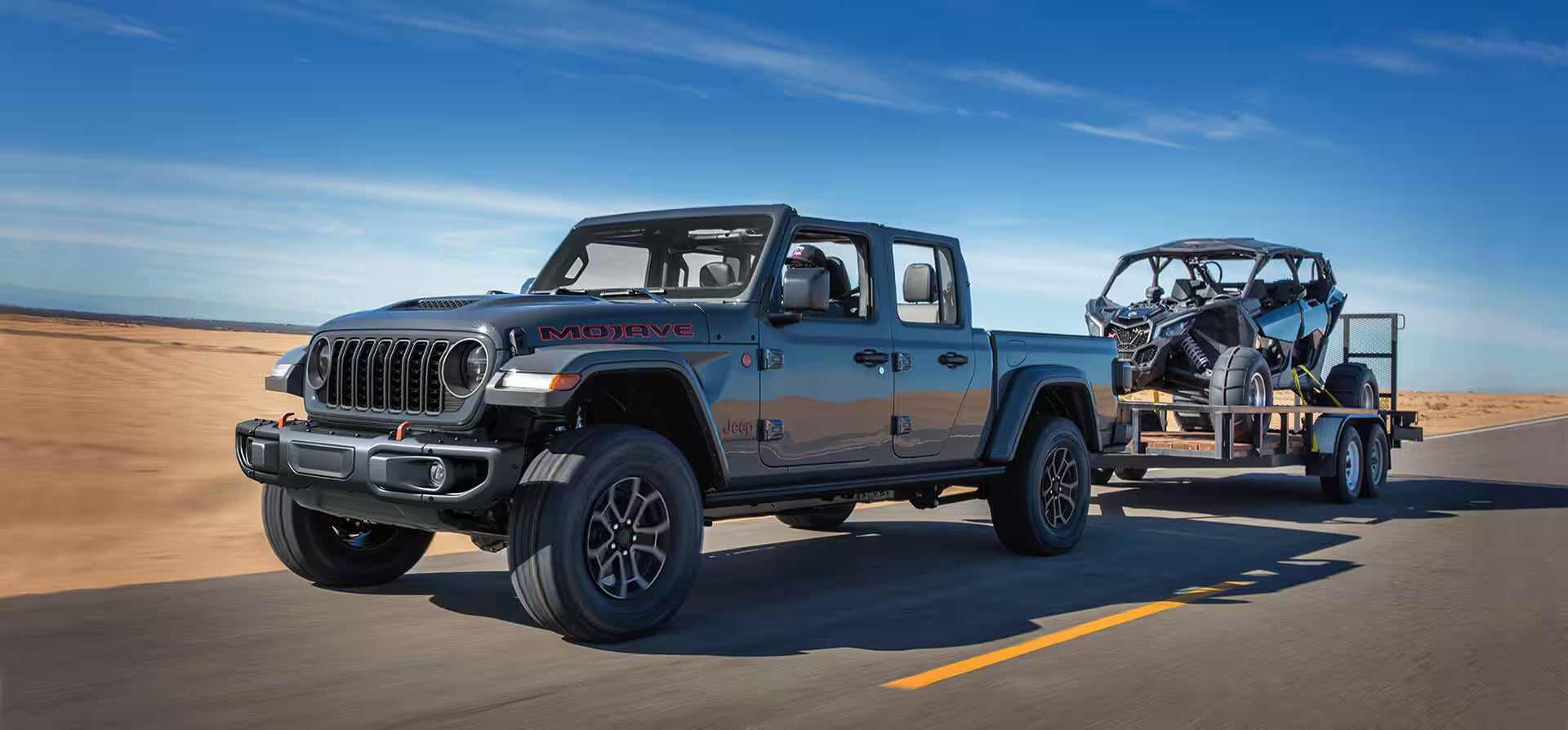 A blue jeep sitting in mud.