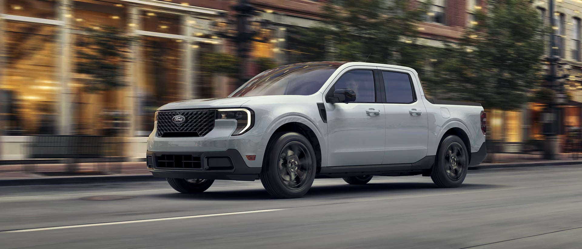 A green truck pulling a mobile home.