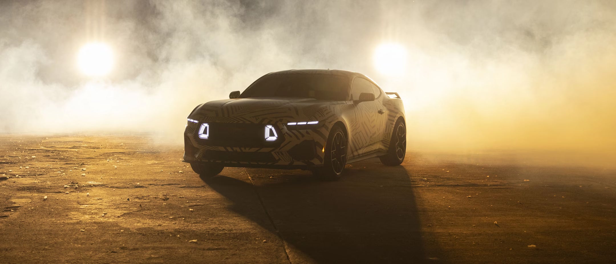 A car sitting parked with smoke around it.