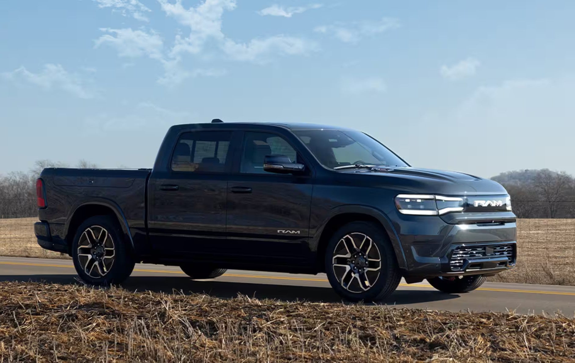 a ram rev parked in a field