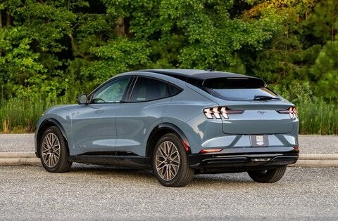 A red suv sitting parked.