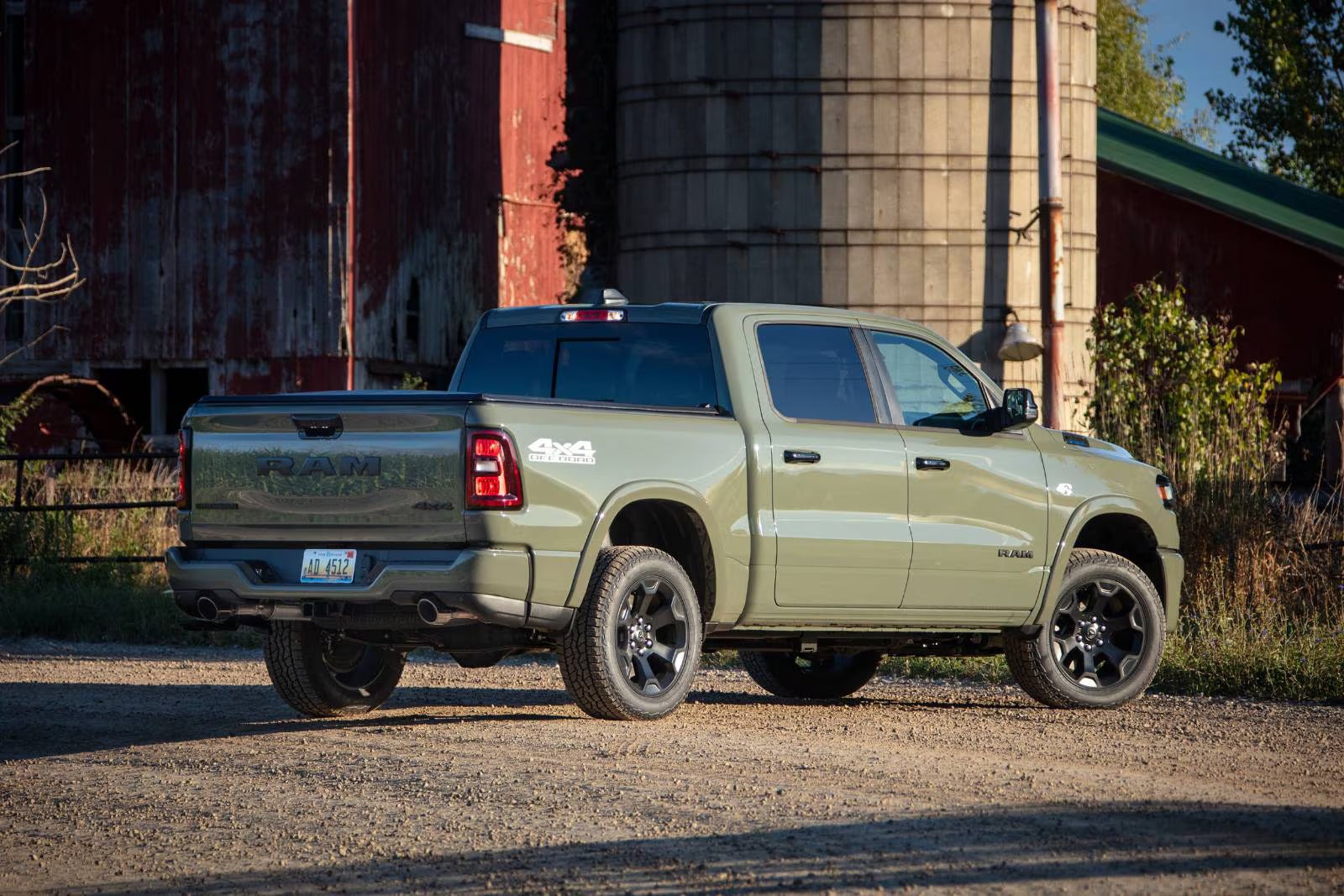 A green truck sitting parked.