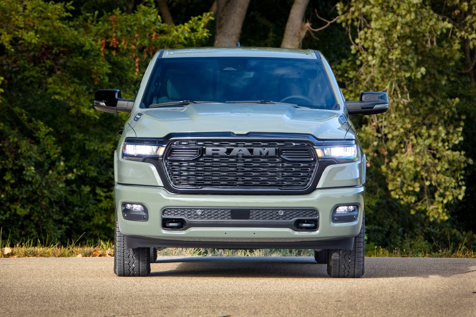 A green truck sitting parked.