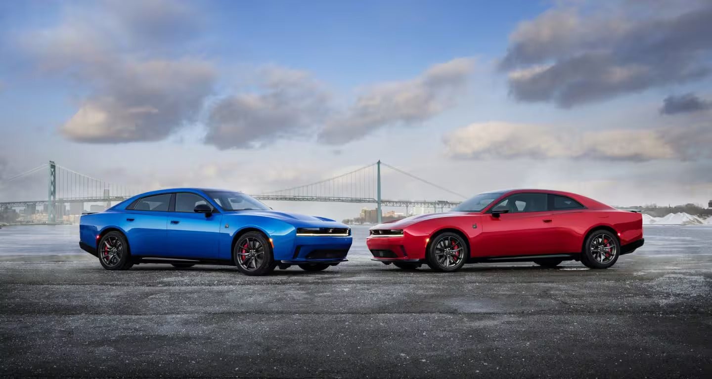 two new 2026 dodge charger's parked on a road