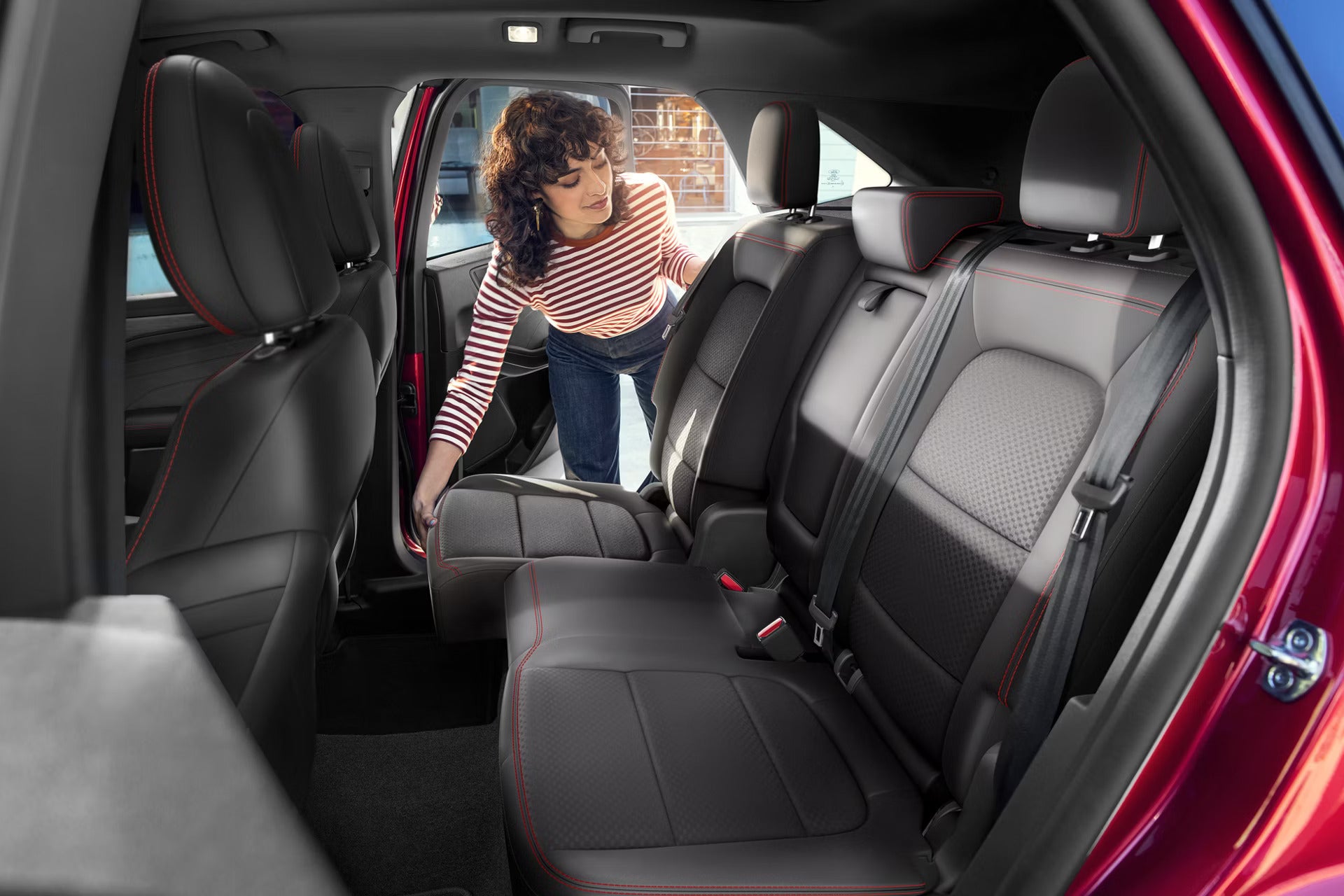 2026 Ford Escape view of a lady moving the back seat.