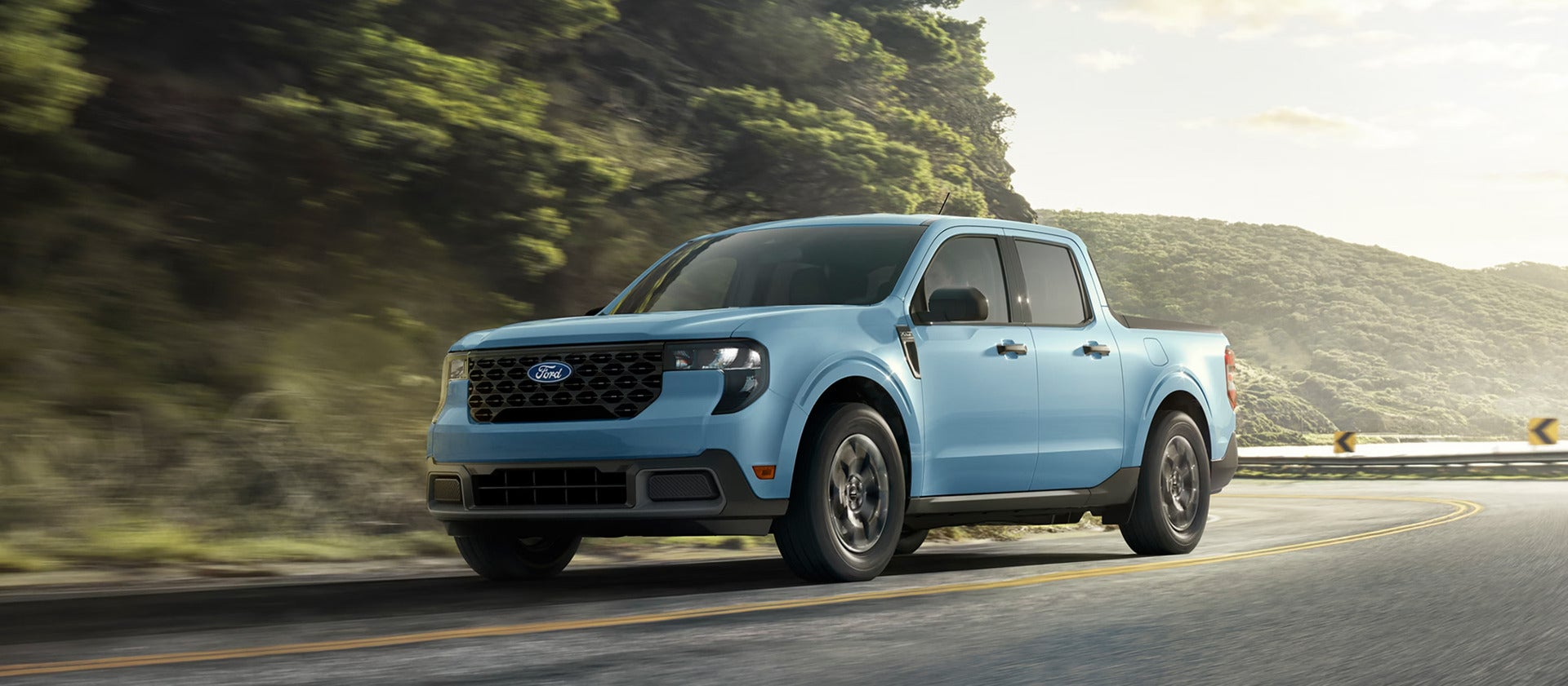 2026 ford maverick driving up a road