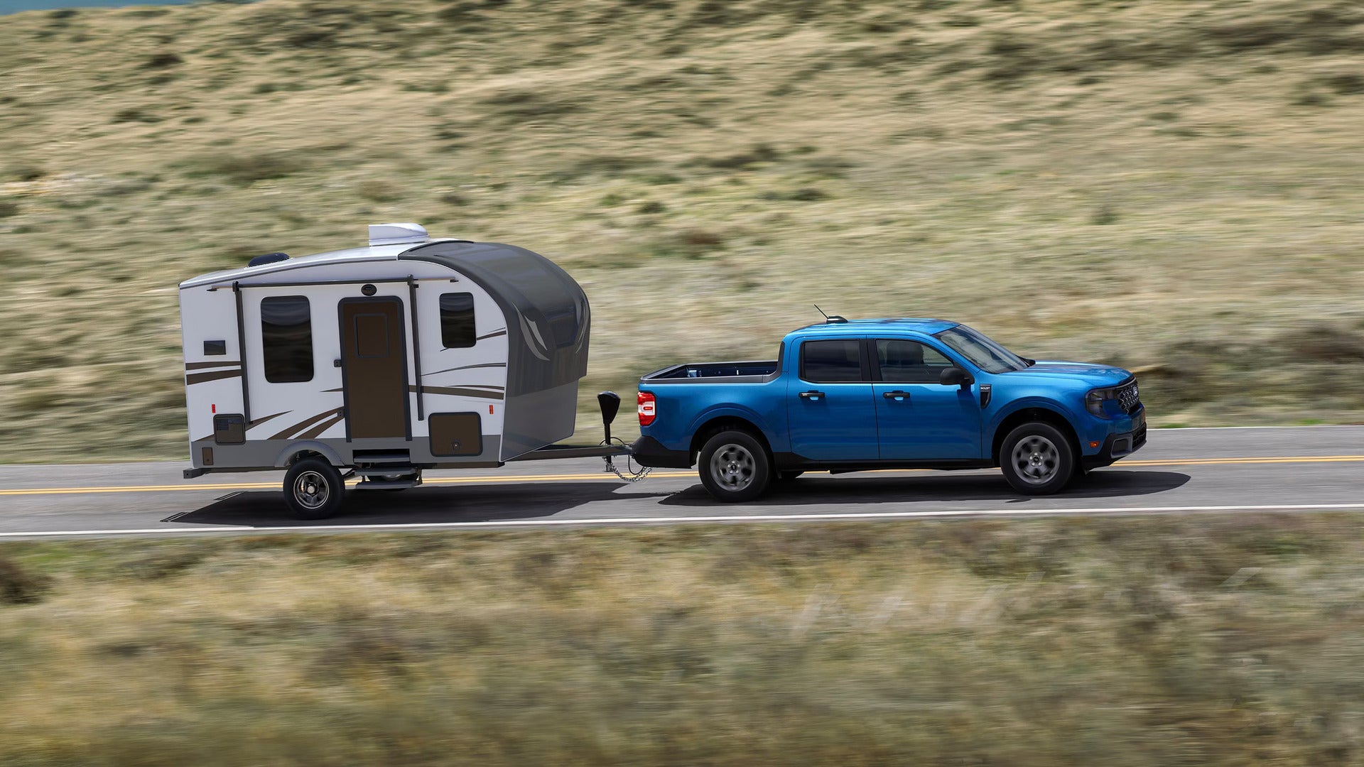 A New 2026 Ford Maverick pulling a trailer