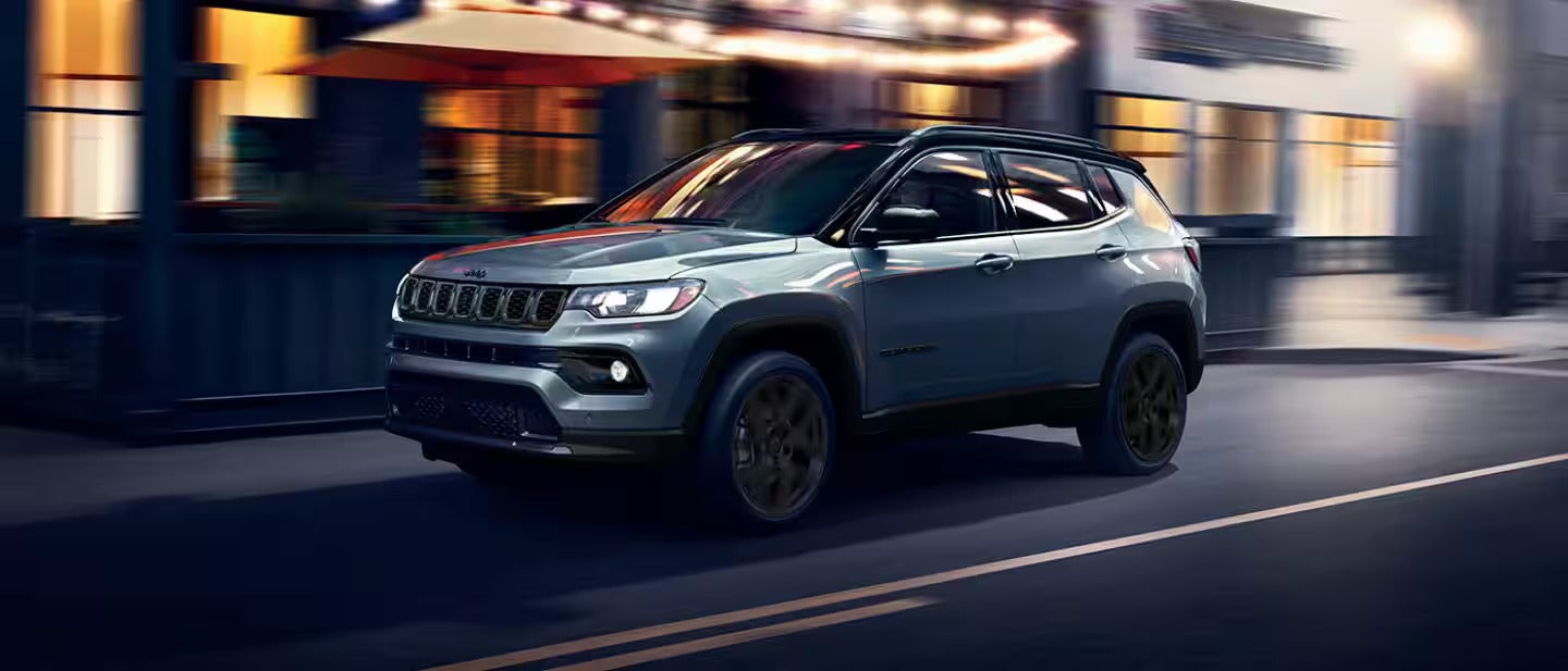 2026 Jeep Compass driving in the city sat night
