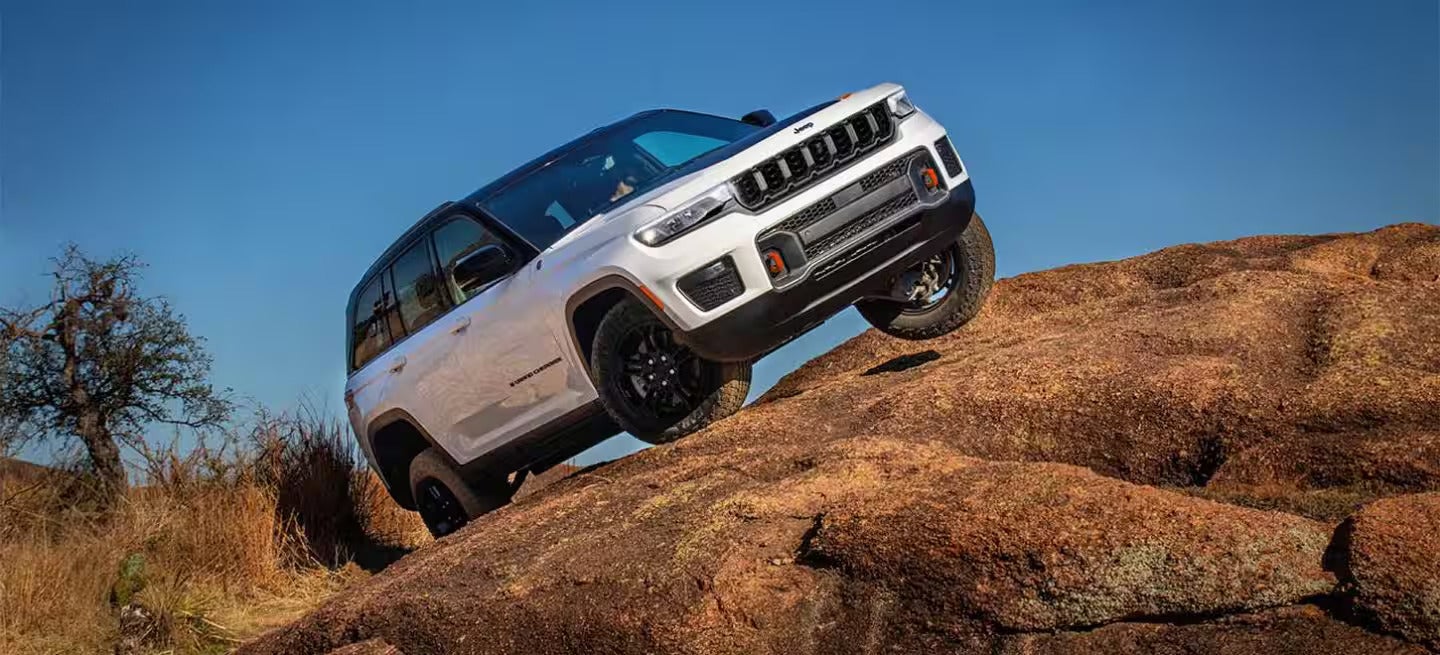 2026 Jeep Grand Cherokee parked on top of a rock