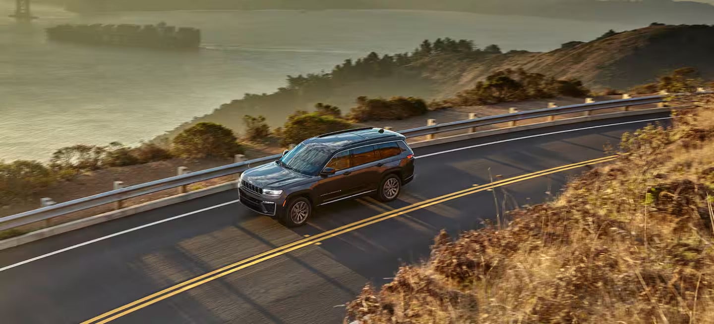 2026 Jeep Grand Cherokee driving on a road