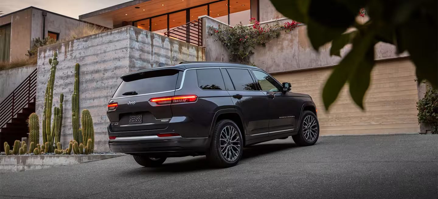 2026 Jeep Grand Cherokee parked outside of a house