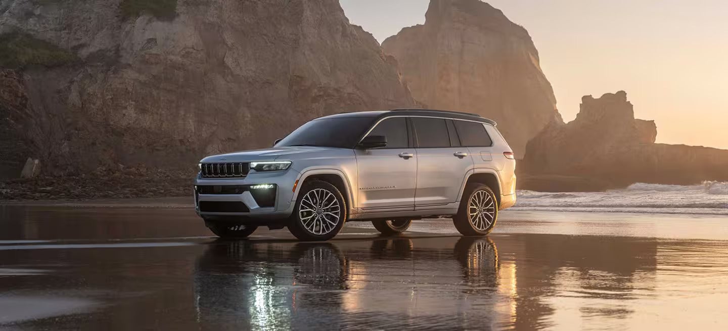 2026 Jeep Grand Cherokee parked on a beach