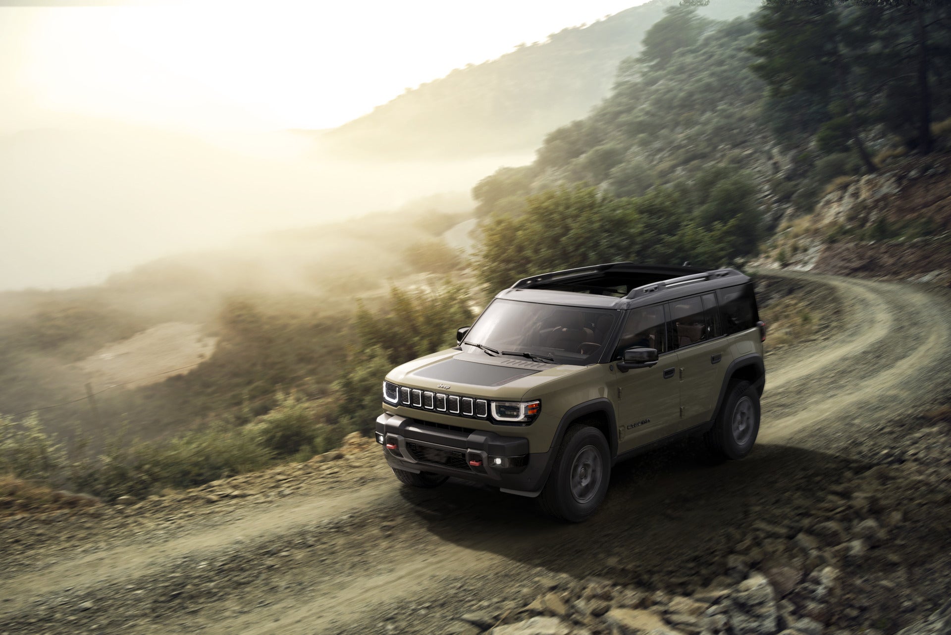 2026 Jeep Recon driving up a hill