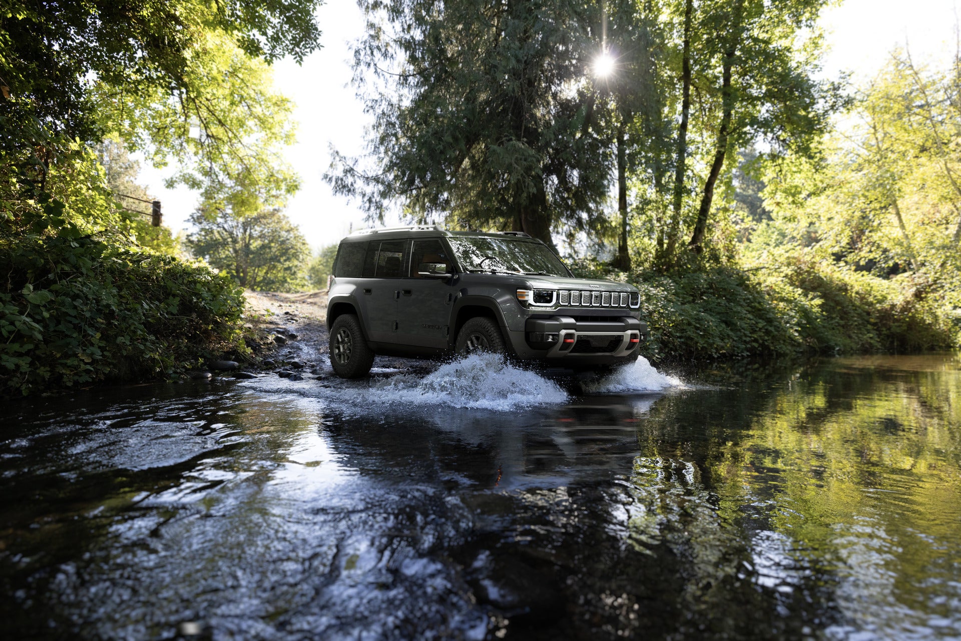 2026 Jeep Recon driving through a creek
